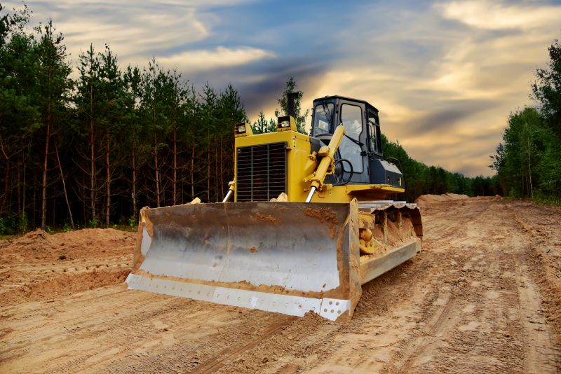 Prepares land for construction and future development projects.